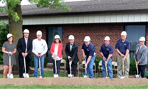 Members of the CREC board break ground on the new building.