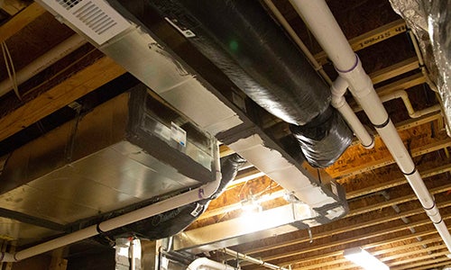 An HVAC unit in a home basement