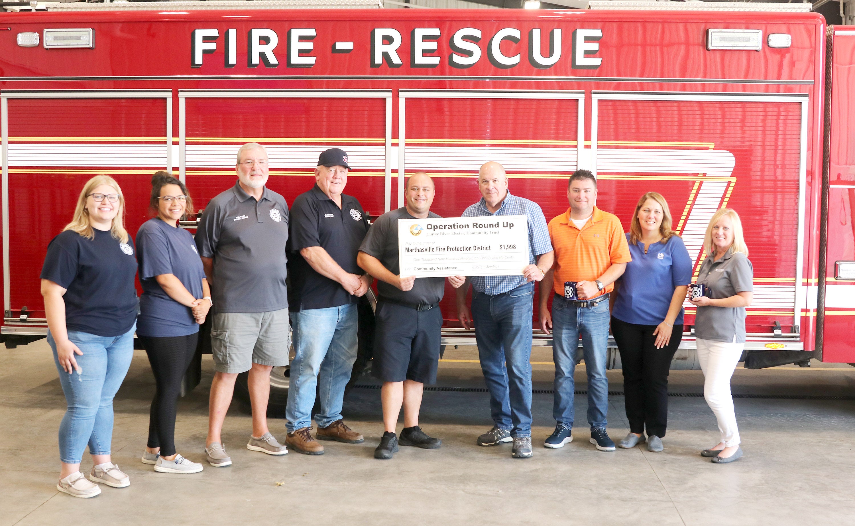 Members of the ORU board and Marthasville Fire protection district with Operation Round Up grant check.